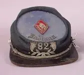Fraternal Kepi Indiana 82 with lily (274x245).webp