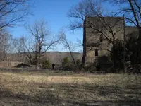 OldRuinsNorthOfDaughertyOK_Photo1_NoteHumanFigureToLeftForScale.webp