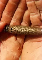 Dagger-handle-in-divers-hands.webp
