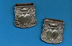 ori__1225609415_1087217_Sterling_silver__Cherub__Suspender_Clips_-_Unger_Brothers.webp