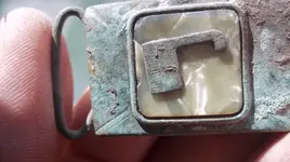 figurine and buckle.webp