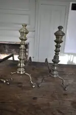 hand-polished-brass-andirons.webp