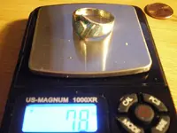 silver ring on scale.webp