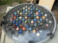 port hole case with marbles.webp