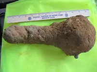 12. object that looks like leg from a wood burning stove.webp