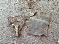 suspender clip and carved piece.webp