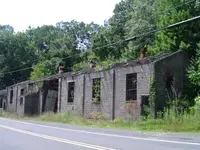 the-carcass-of-a-brick-building.webp