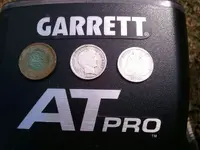 3 coins AT Pro 9-14-12 close up.webp