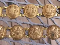 ladies-patriotic-belt_1880s-1910s_eagles-and-Musicians-lyre_front_closeup_8567.webp