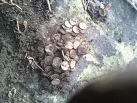 143 pennies in a coin spill.webp