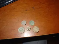 group shot buttons and coin.webp