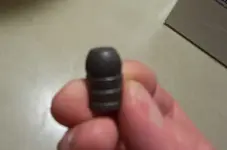 Bullet in hand.webp