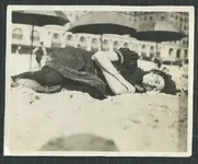 Sleeping on beach 1910s.webp