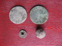 2 coppers 1 button 1 musketball.webp