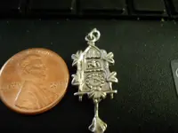 birdhouseclockcharm.webp