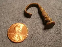 SEAL SPOON HANDLE END FASHIONED INTO A PIPE TAMPER.webp