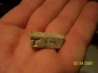 bullet with T carved into it.webp