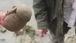 Raymond holds the idol.webp