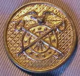 insignia_collar-disc_US-Army_Quartermaster-Corps_checkerboard-background_1926-1937_type2qmgilt1.webp