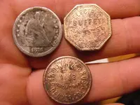 2 Tokens Seated Quarter.webp
