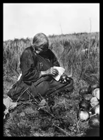 0086-0332-Owl-Woman-Paige--Phillip-Baker-great-grandmother-slicing-squash-cor.webp