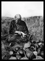0086-0334-Owl-Woman-Paige--Phillip-Baker-great-grandmother-slicing-squash-cor.webp