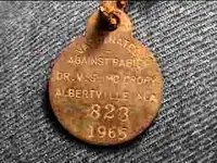 1965 rabies shot tag and collar buckle.webp