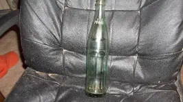 Coke bottle and rocks 013.webp