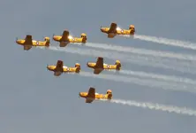 Kunal-Mehta-Shutterstock.com-CHICAGO-IL-AUGUST-18-The-Lima-Lima-Flight-Team-flies-in-their-Be...webp