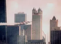 ThunderbirdsInFrontOfBuildingsHeadingRight.webp