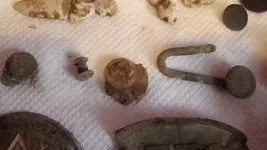 rivets and a knap sack hook.webp