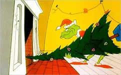 Grinch tree up chimney.webp