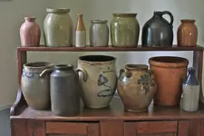 Salt-glazed-Redware-bottles-crocks-and-jugs-gathered-from-New-York-State-circa-1790-1860.webp