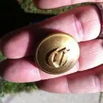 button_Old-English-C_Livery-button_1850s-era_ScovillMfgCoWaterbury-RMDC-backmark_frontview_Ebay.webp
