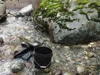 Sniper and a rock.webp