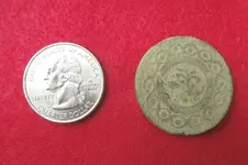 dandy button with quarter.webp