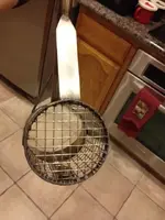 Sand scoop back of basket with foot plate.webp