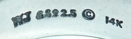 silver and gold ring.webp