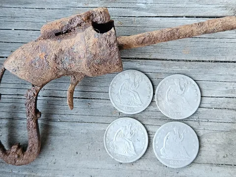 Four Seated Liberty Half Dollars (including a rare one) and a Gun. by winslow