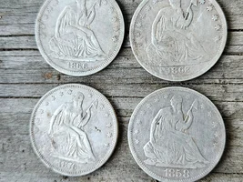 Four Seated Liberty Half Dollars (including a rare one) and a Gun.