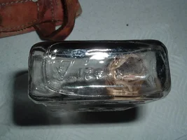 Bottle with a note inside 5 to 6 inches deep in the ground.