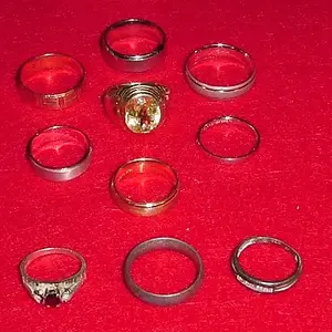 RINGS FROM JAMAICA TRIP - FOUND 20 - 18 SHOWN 
(1 RETURNED - 1 STOLEN THAT ARE MISSING FROM PIC)