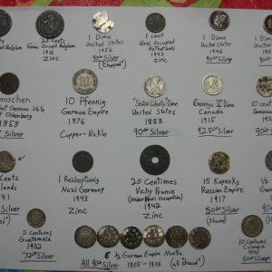 Hoard of International and Domestic silver coins all from mid 1800's - mid 1900's. Special Note Silver Coins: key-date 1915 George V Dime, 1883 Seated