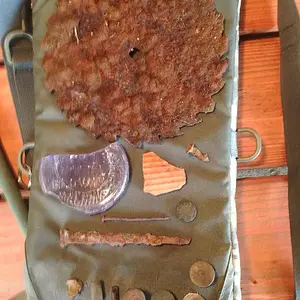 Saw blade, pre electrolysis, shotgun ends, pottery shards, etc