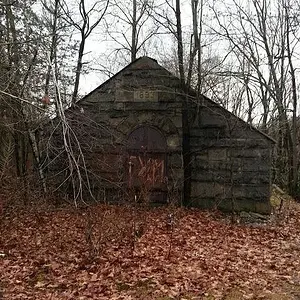 An old building along the river. Dated 1893. No luck here