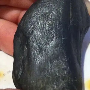 up close photo of the lump and surface around it. Appears to have burned under high temperatures.