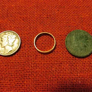 Very tiny gold ring.