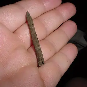ROLLED COPPER - FOUND AT A MARKED INDIAN CAMP OF THE KING PHILLIPS WAR - DONT KNOW IF IT WAS USED AS AN AWL - OR FOR AN ARROW POINT