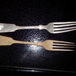 2 silver plated forks. One heavily worn