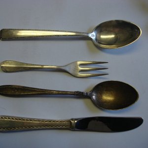 Sterling teas spoons, salad fork, and butter knife
